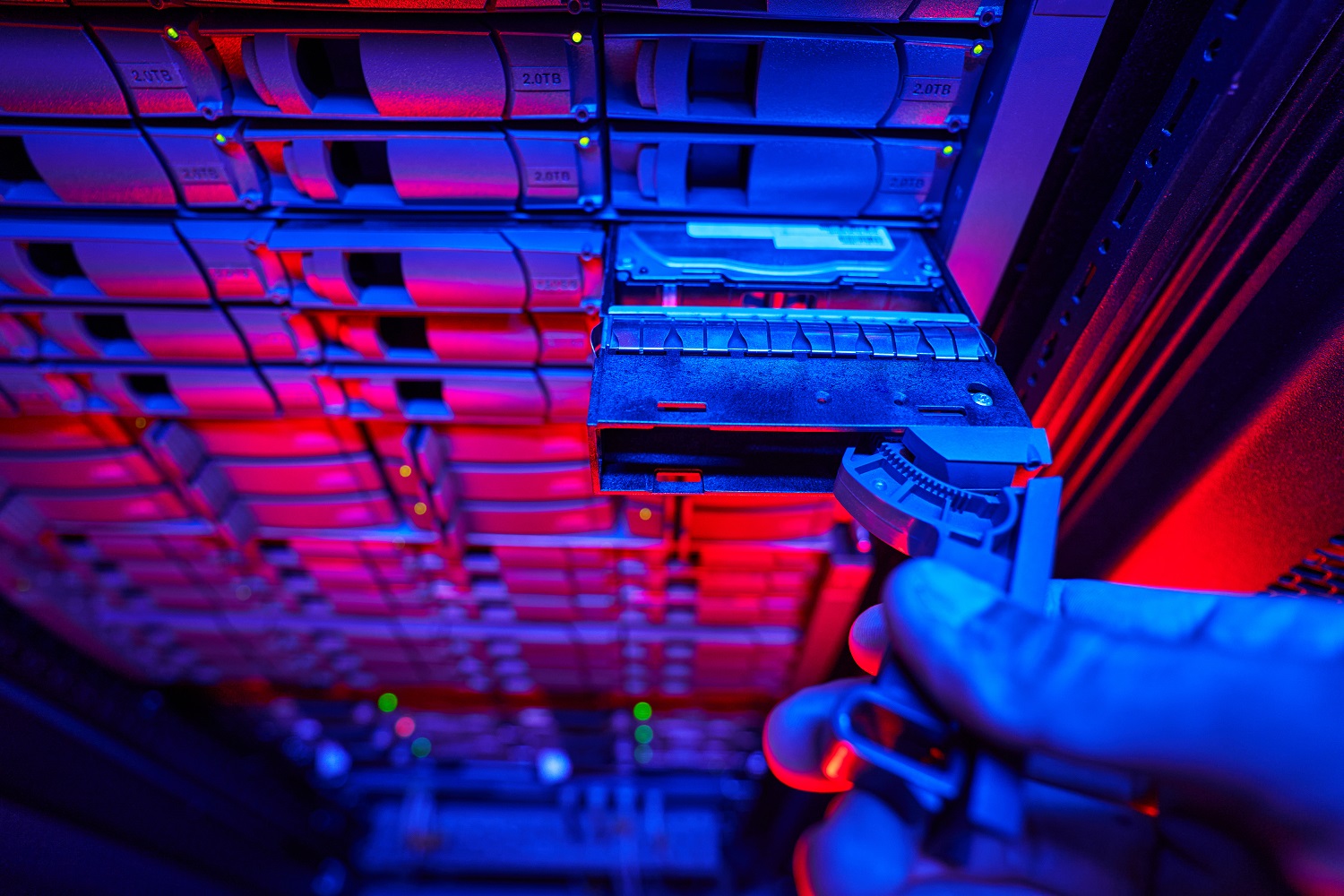 Close up front view portrait of server racks with working HDD disks and hard drives